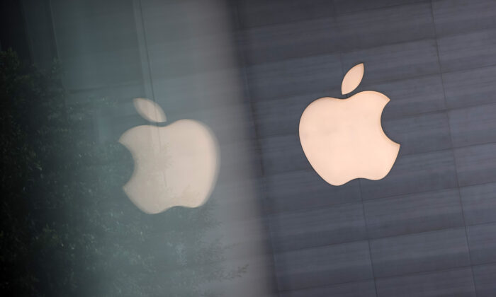 An Apple logo is reflected on glass at the Apple Store at Orchard Road in Singapore, on Sept. 24, 2021. (Feline Lim/Getty Images)