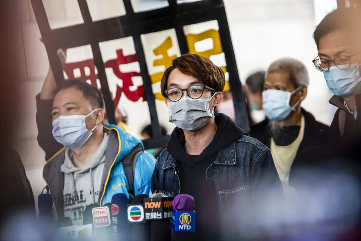 Former Convener of Civil Human Rights Front Figo Chan (C) talks to the media outside West Kowloon Court in Hong Kong on Dec. 17, 2020. (Isaac Lawrence/AFP via Getty Imges)