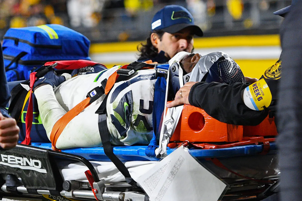Darrell Taylor #52 of the Seattle Seahawks is carted off the field after an injury during a game against the Pittsburgh Steelers at Heinz Field in Pittsburgh, Pennsylvania, on Oct. 17, 2021. (Joe Sargent/Getty Images)