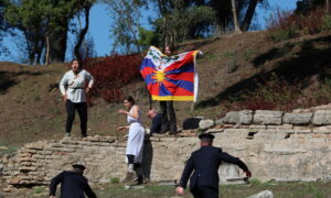 Human Right Activists Stage Protest at Beijing Olympics Torch-Lighting Ceremony