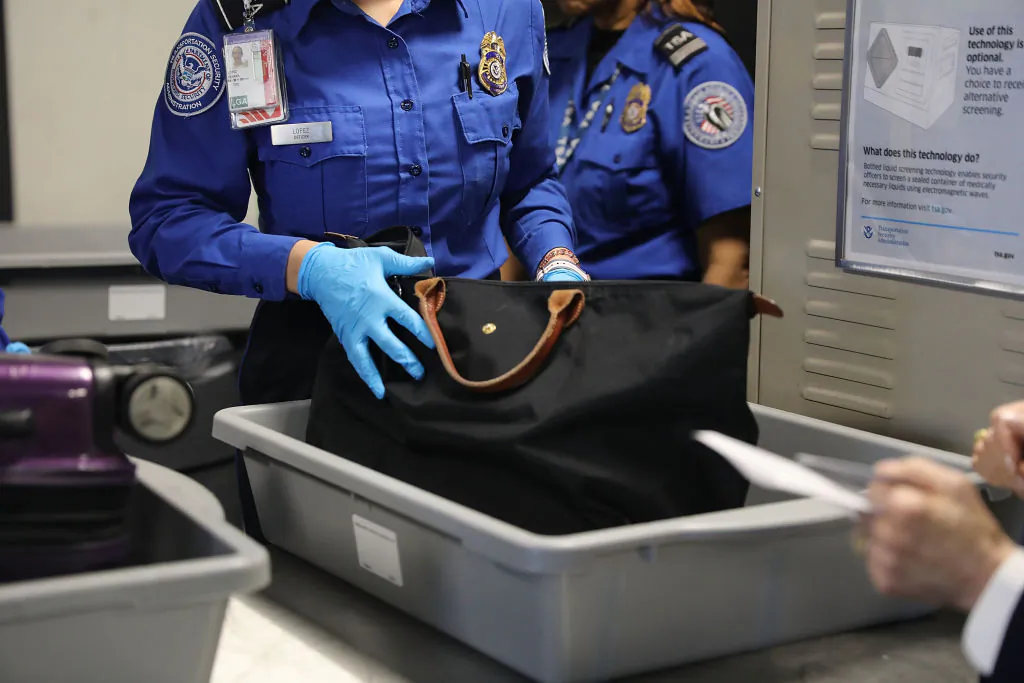 A Transportation Security Administration (TSA) worker screens luggage in New York City, on Sept. 26, 2017. (Spencer Platt/Getty Images)