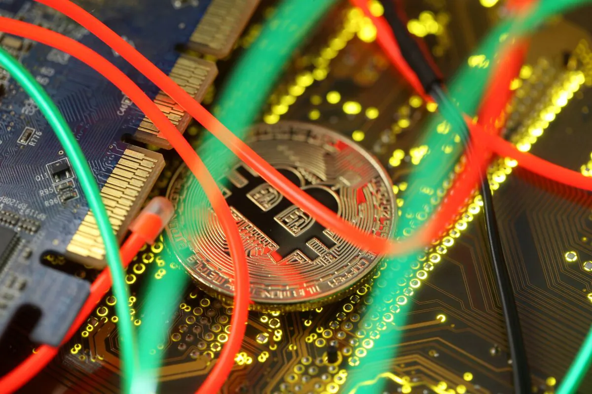 Representation of the Bitcoin virtual currency standing on the PC motherboard is seen in this illustration picture on Feb. 3, 2018. (Dado Ruvic/Illustration/Reuters)