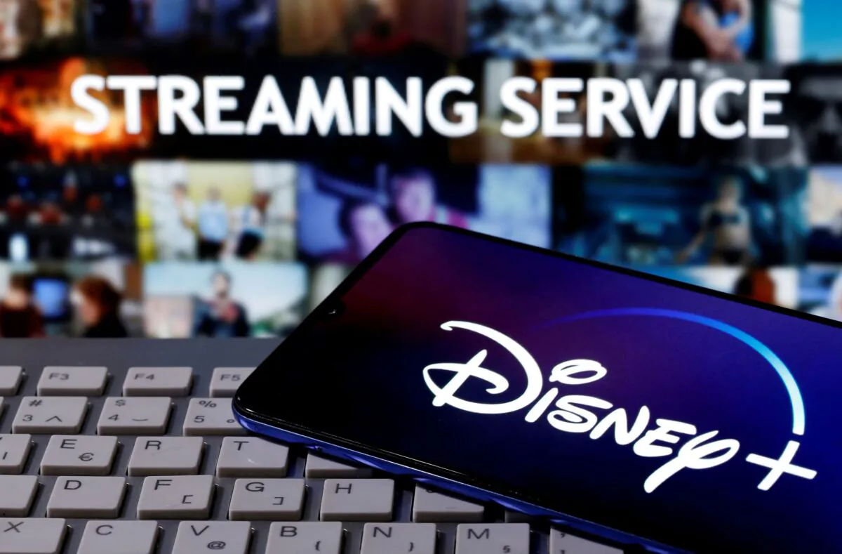 A smartphone with the "Disney" logo is seen on a keyboard in front of the words "Streaming service" in this picture illustration taken on March 24, 2020. (Dado Ruvic/Reuters)