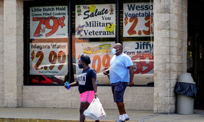 Shoppers leave a Piggly Wiggly supermarket in Columbus, Ga., on Sep. 8, 2020. (Elijah Nouvelage/Reuters)