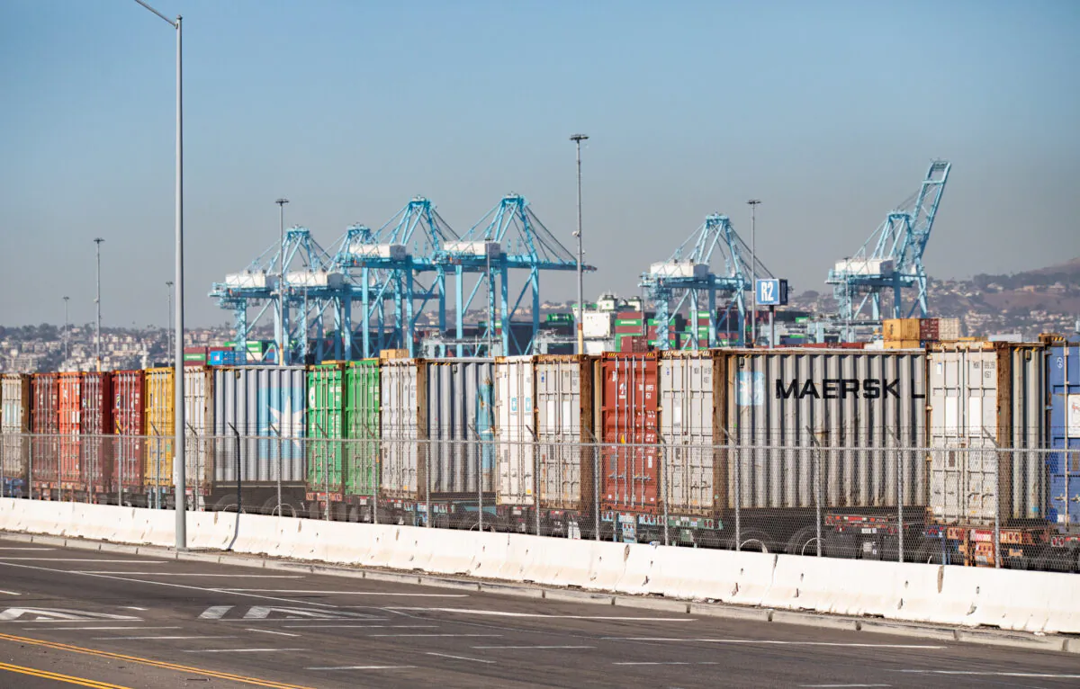 Shipping containers wait to be transferred from the ports of Los Angeles and Long Beach on Oct. 14, 2021. (John Fredricks/The Epoch Times)