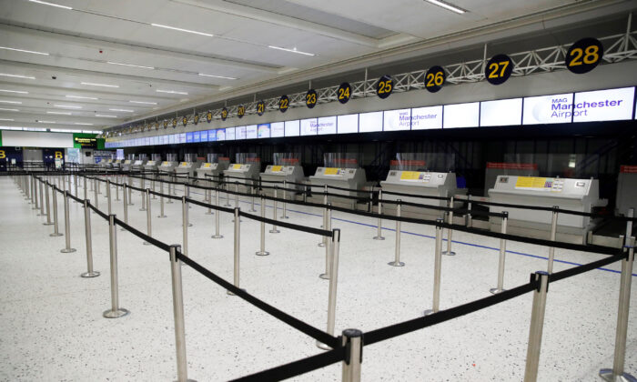 An empty check in area is seen at Manchester Airport in Manchester, UK, on June 8, 2020. (Phil Noble/Reuters)