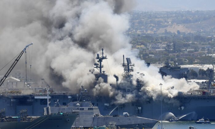 Smoke rises from the USS Bonhomme Richard at Naval Base San Diego in San Diego, Calif., on July 12, 2020. (Denis Poroy/AP Photo)