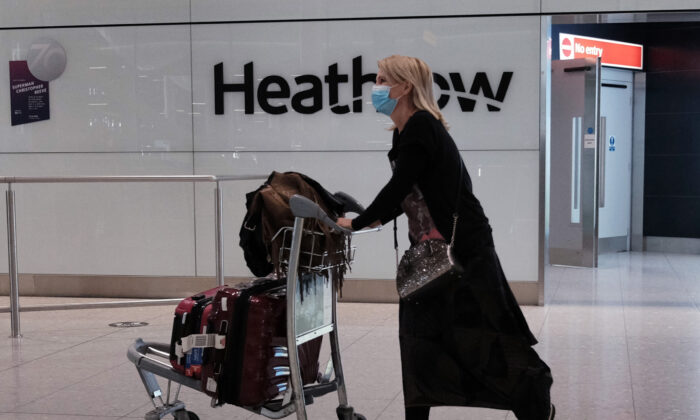 Passengers arrive back in the UK at Heathrow Terminal 2, during England's third national lockdown to curb the spread of coronavirus, on Jan. 29, 2021. (Yui Mok/PA)