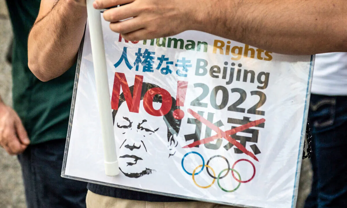 Activists take part in a protest calling for a boycott of the Beijing 2022 Olympic Games over China's human rights record, in Tokyo on October 2, 2021. (Philip Fong/AFP via Getty Images)