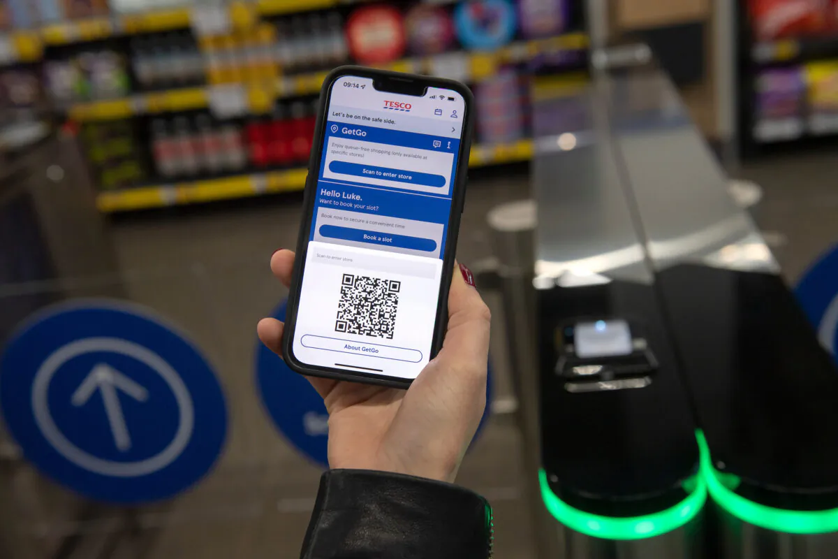 Undated Tesco handout photo of a customer using the Tesco GetGo store in Holborn, London. (Ben Stevens/Tesco/PA)