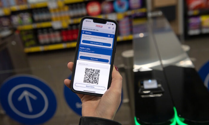 Undated Tesco handout photo of a customer using the Tesco GetGo store in Holborn, London. (Ben Stevens/Tesco/PA)