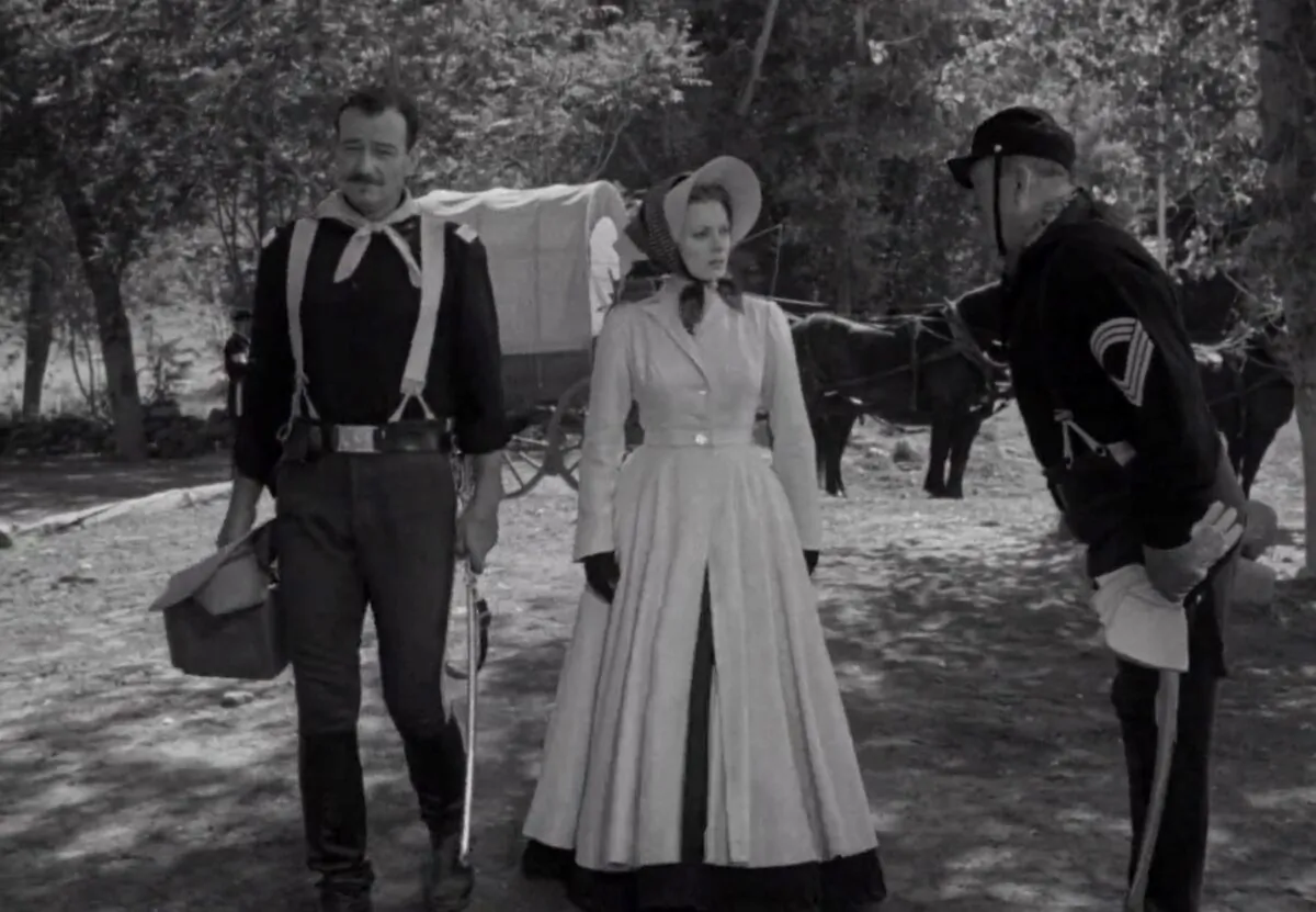 (L–R) Lt. Col. Kirby Yorke (John Wayne), Kathleen Yorke (Maureen O’Hara), and Sgt. Maj. Timothy Quincannon  (Victor McLaglen), in “Rio Grande.” (Republic Pictures).