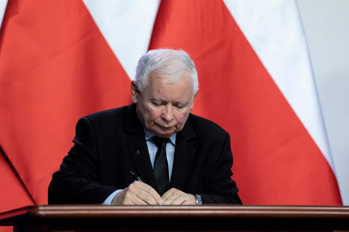 Law and Justice leader Jaroslaw Kaczynski signs a coalition agreement in Warsaw, Poland, on Sept. 26, 2020. (David Zuchowicz/Agencja Gazeta via Reuters)