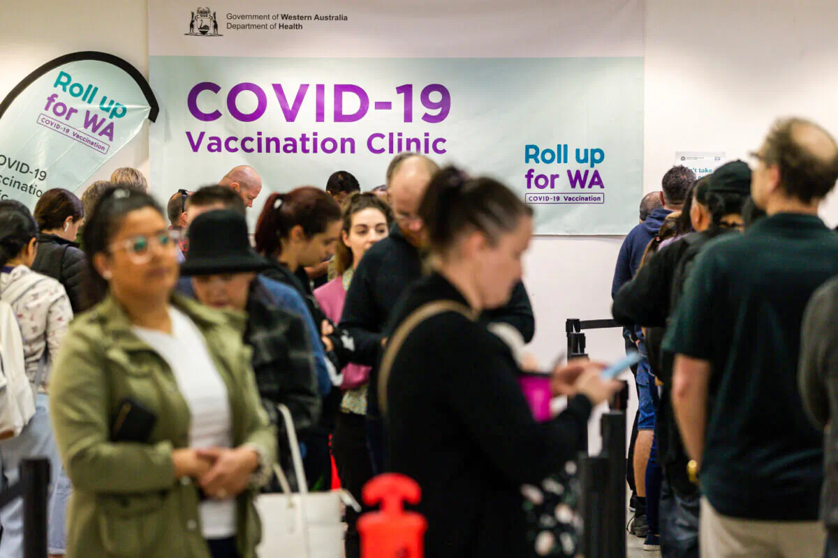 Members of the public wait to be vaccinated at a COVID-19 mass vaccination clinic in Midland, an eastern suburb of Perth, Australia on Sep. 9, 2021. Western Australia currently has the lowest percentage of people double-vaccinated in the country. (AAP Image/Richard Wainwright)