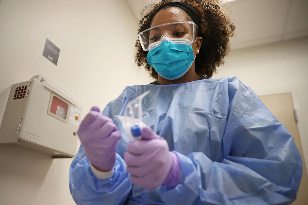 A medical assistant prepares to test a patient for the novel coronavirus in Woodbridge, Va., on April 15, 2020. (Chip Somodevilla/Getty Images)