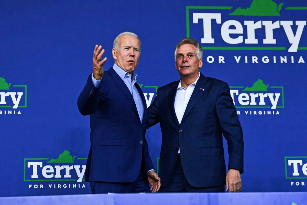 President Joe Biden (L) greets Virginia gubernatorial candidate Terry McAuliffe during a campaign event at Lubber Run Park, Arlington, Virginia on July 23, 2021. ( Brendan Smialowski/AFP via Getty Images)