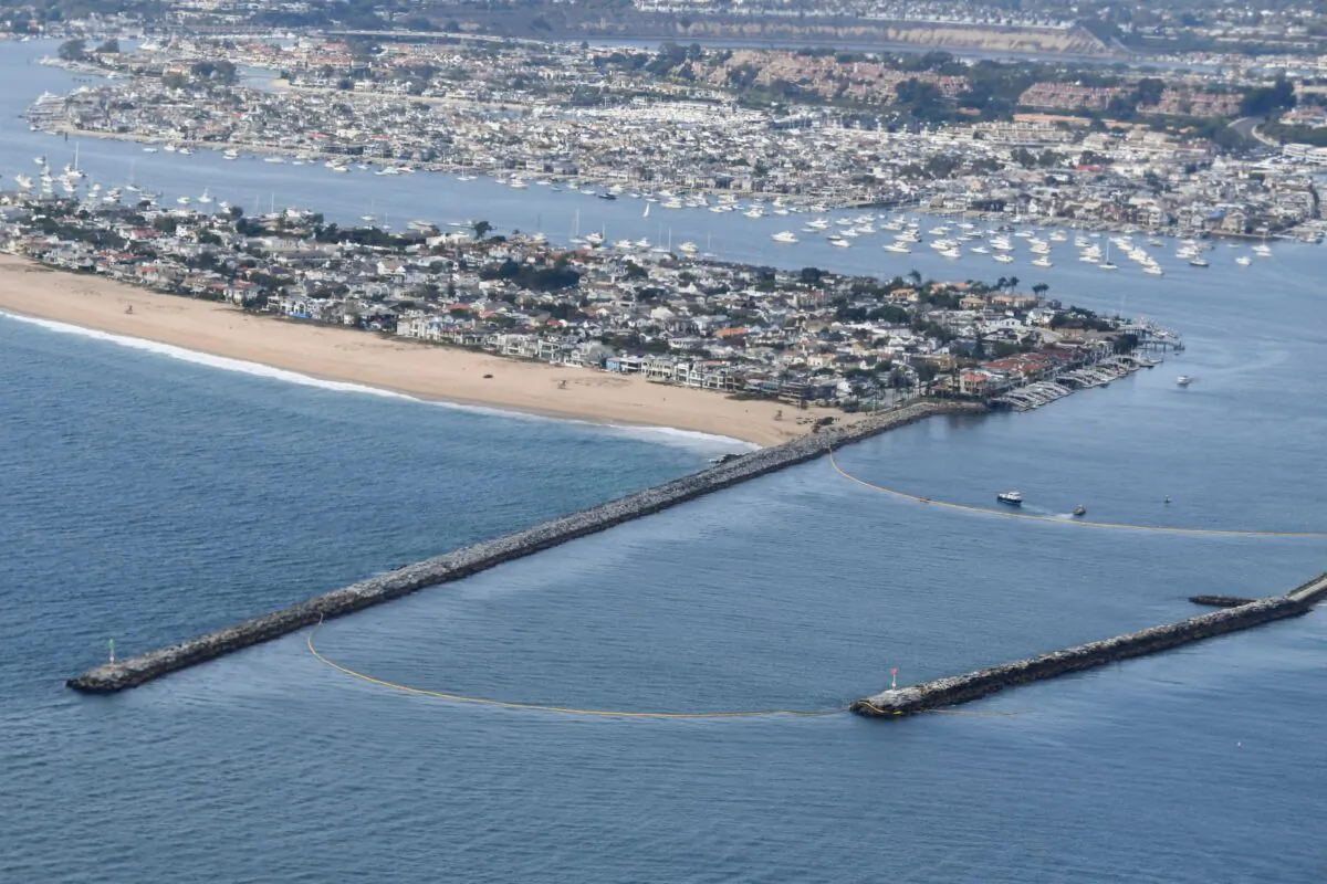 Oil containment boom barriers block the entrance to Newport Beach Harbor in Newport Beach, Calif., on Oct. 6, 2021. (Patrick T. Fallon/AFP via Getty Images)