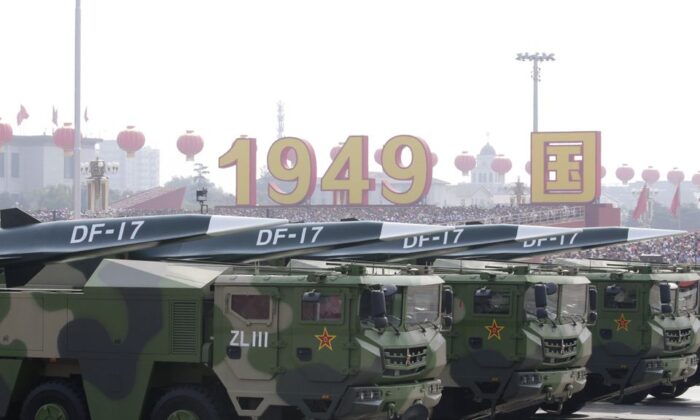 Military vehicles carrying hypersonic DF-17 missiles travel past Tiananmen Square during a military parade in Beijing, China, on Oct. 1, 2019. (Jason Lee/Reuters)