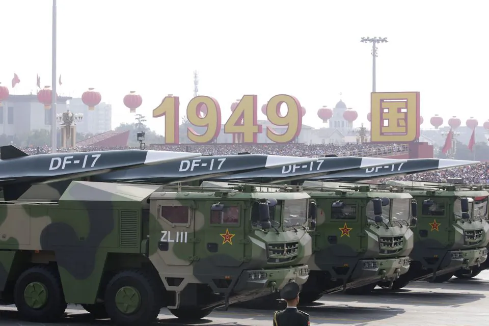 Military vehicles carrying hypersonic DF-17 missiles travel past Tiananmen Square during a military parade in Beijing, China, on Oct. 1, 2019. (Jason Lee/Reuters)