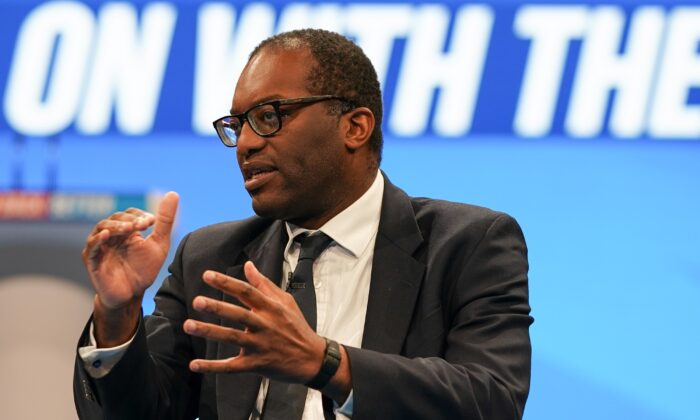 Kwasi Kwarteng, secretary of state for business, energy and industrial strategy, holds a discussion with Tees Valley Mayor Ben Houchen on the second day of the Conservative Party Conference in Manchester, on Oct. 4, 2021. (Ian Forsyth/Getty Images)