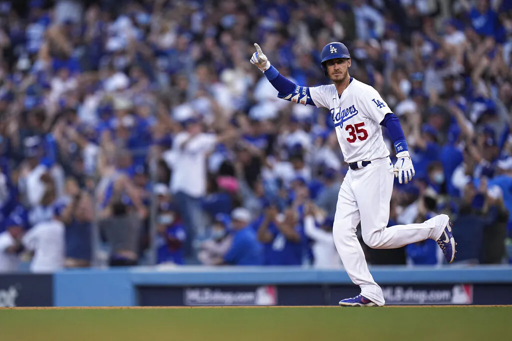 Los Angeles Dodgers center fielder Cody Bellinger reacts after hitting a three-run home run during the eighth inning in Game 3 of baseball's National League Championship Series against the Atlanta Braves in Los Angeles on Oct. 19, 2021. (Jae Hong/AP Photo)