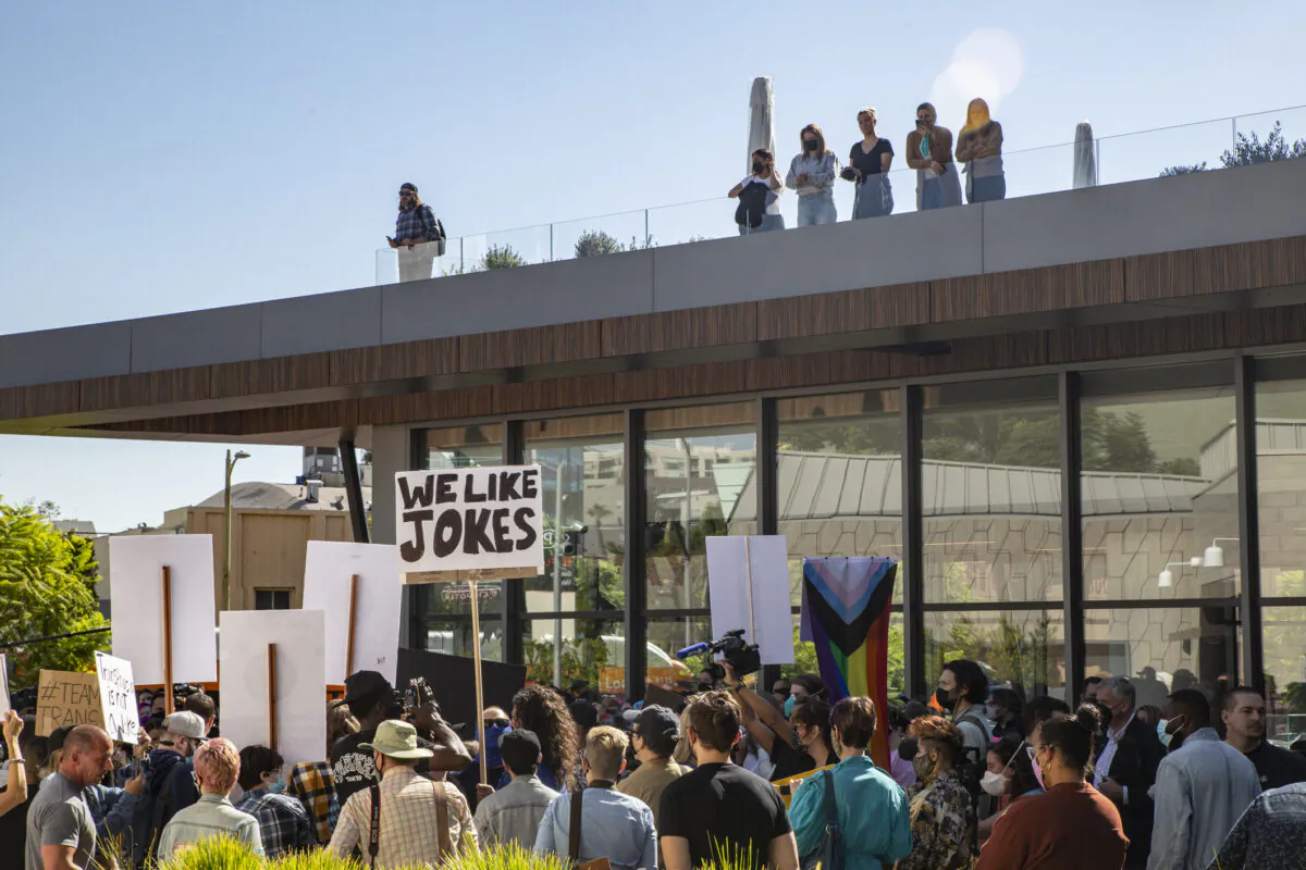 Protestors and counter-protestors voicing for or against a popular Dave Chapelle comedy special currently airing on Netflix gather in front of Netflix's Vine Street offices in Los Angeles on Oct. 20, 2021. (John Fredricks/The Epoch Times)