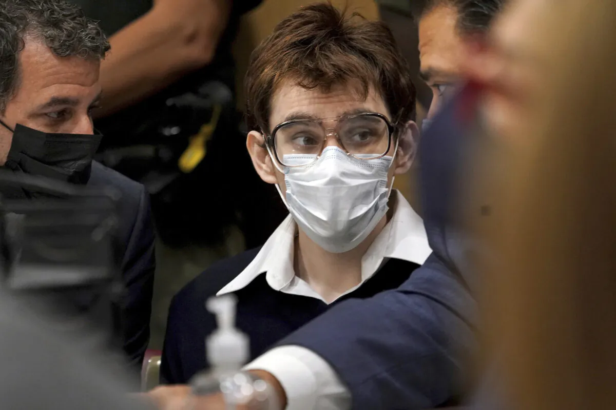 Parkland school shooter Nikolas Cruz is shown in court at the defense table with his defense attorneys, Gabe Ermine, left, and David Wheeler at the Broward County Courthouse in Fort Lauderdale, Fla., on Oct. 15, 2021. (Amy Beth Bennett/South Florida Sun Sentinel via AP)
