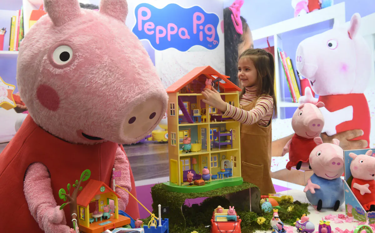 A young girl plays with Peppa Pig toys during the press preview of the international toys fair Spielwarenmesse in Nuremberg, southern Germany, on Jan. 28, 2020. (Christof Stache/AFP via Getty Images)