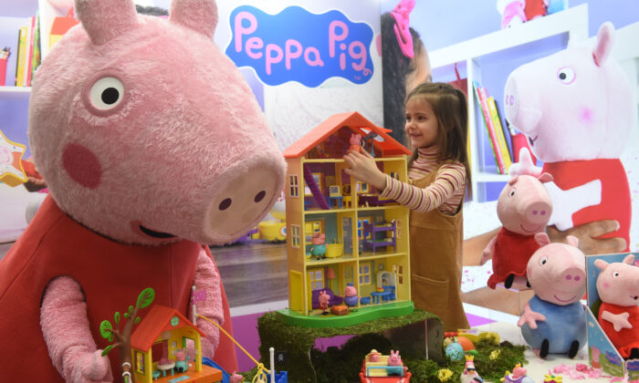 A young miss  plays with Peppa Pig toys during the property   preview of the planetary   toys just  Spielwarenmesse successful  Nuremberg, confederate  Germany, connected  Jan. 28, 2020. (Christof Stache/AFP via Getty Images)
