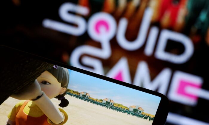  Netflix series "Squid Game" is played on a mobile phone in this picture illustration taken on Sept. 30, 2021. (Kim Hong-Ji/Illustration/Reuters)