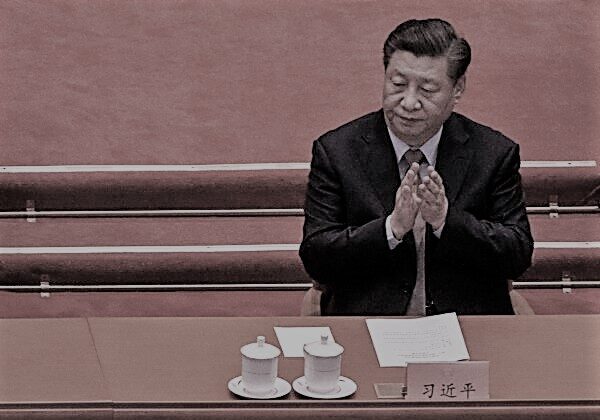 Chinese leader Xi Jinping applauds during the opening session of the Chinese People's Political Consultative Conference at the Great Hall of the People in Beijing on March 4, 202. (Kevin Frayer/Getty Images)