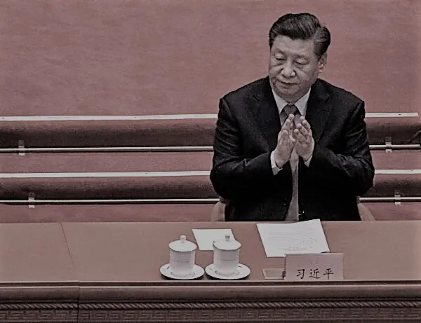 Chinese leader Xi Jinping applauds during the opening session of the Chinese People's Political Consultative Conference at the Great Hall of the People in Beijing on March 4, 202. (Kevin Frayer/Getty Images)