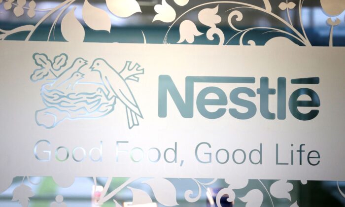 Nestle logo is pictured on the door of the supermarket of Nestle headquarters in Vevey, Switzerland on Feb. 13, 2020. (Pierre Albouy/Reuters)