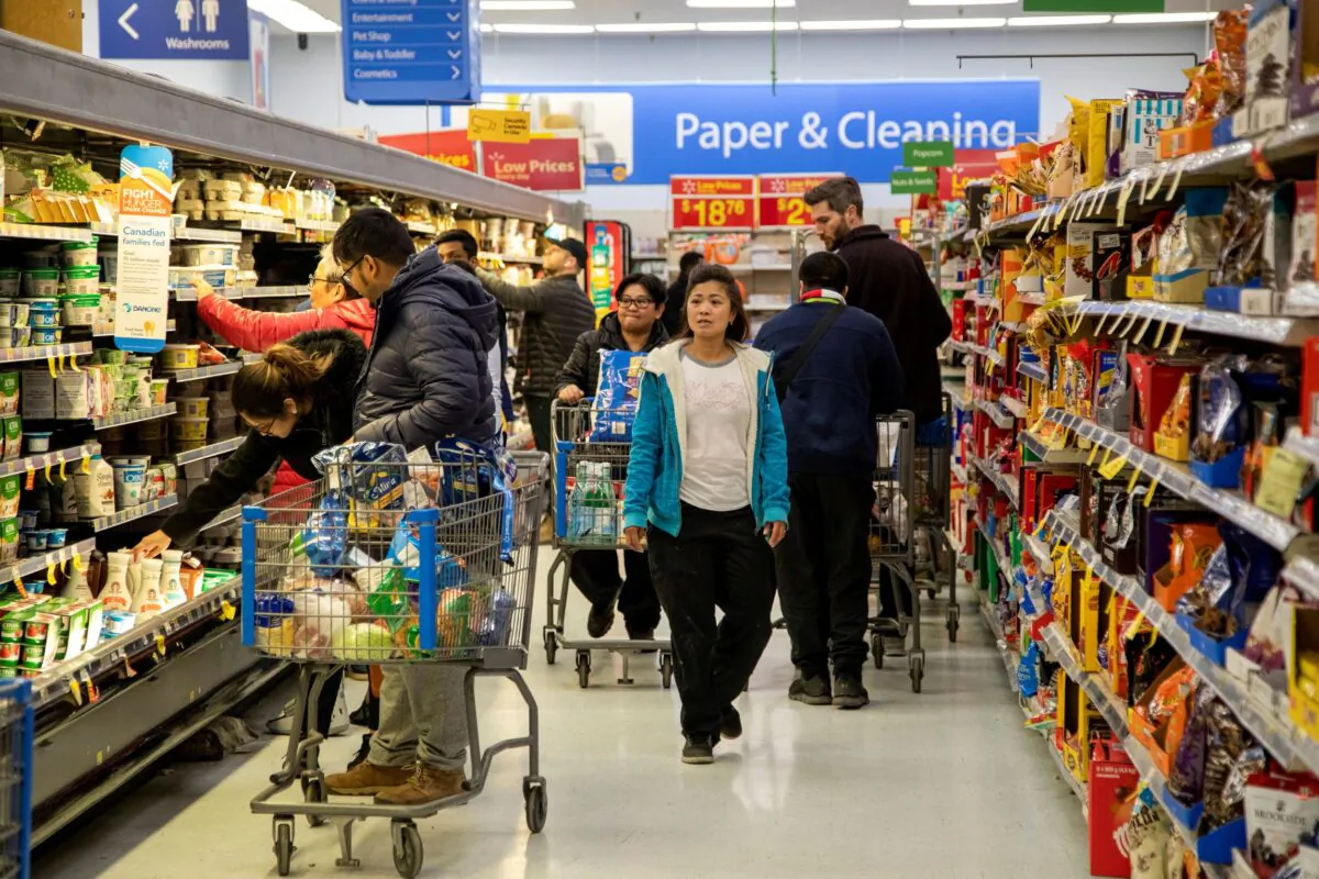 People shop at a Walmart Supercentre amid coronavirus fears spreading in Toronto, Ontario, Canada on March 13, 2020. (Carlos Osorio/Reuters)