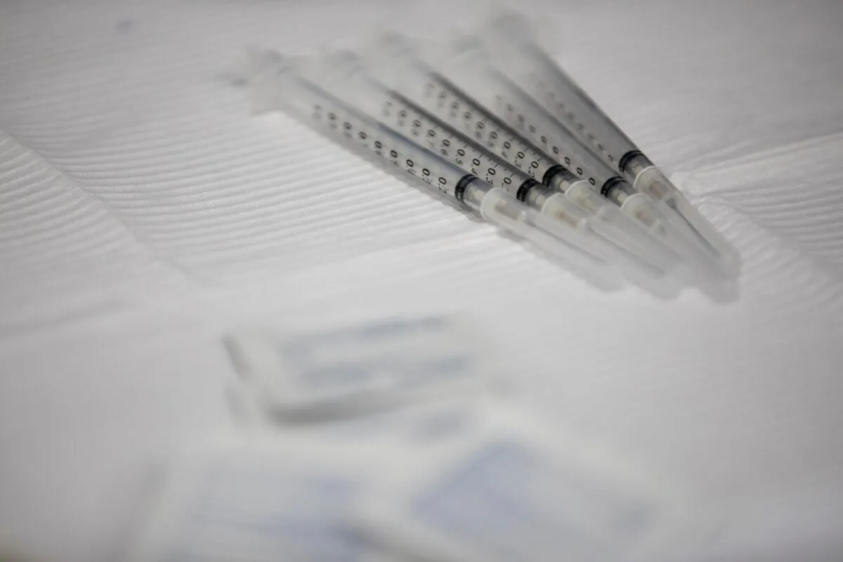 Syringes used with the Pfizer-BioNTech vaccine on table during vaccine clinic in Southfield, Mich., on Sept. 29, 2021. (Emily Elconin/Reuters)