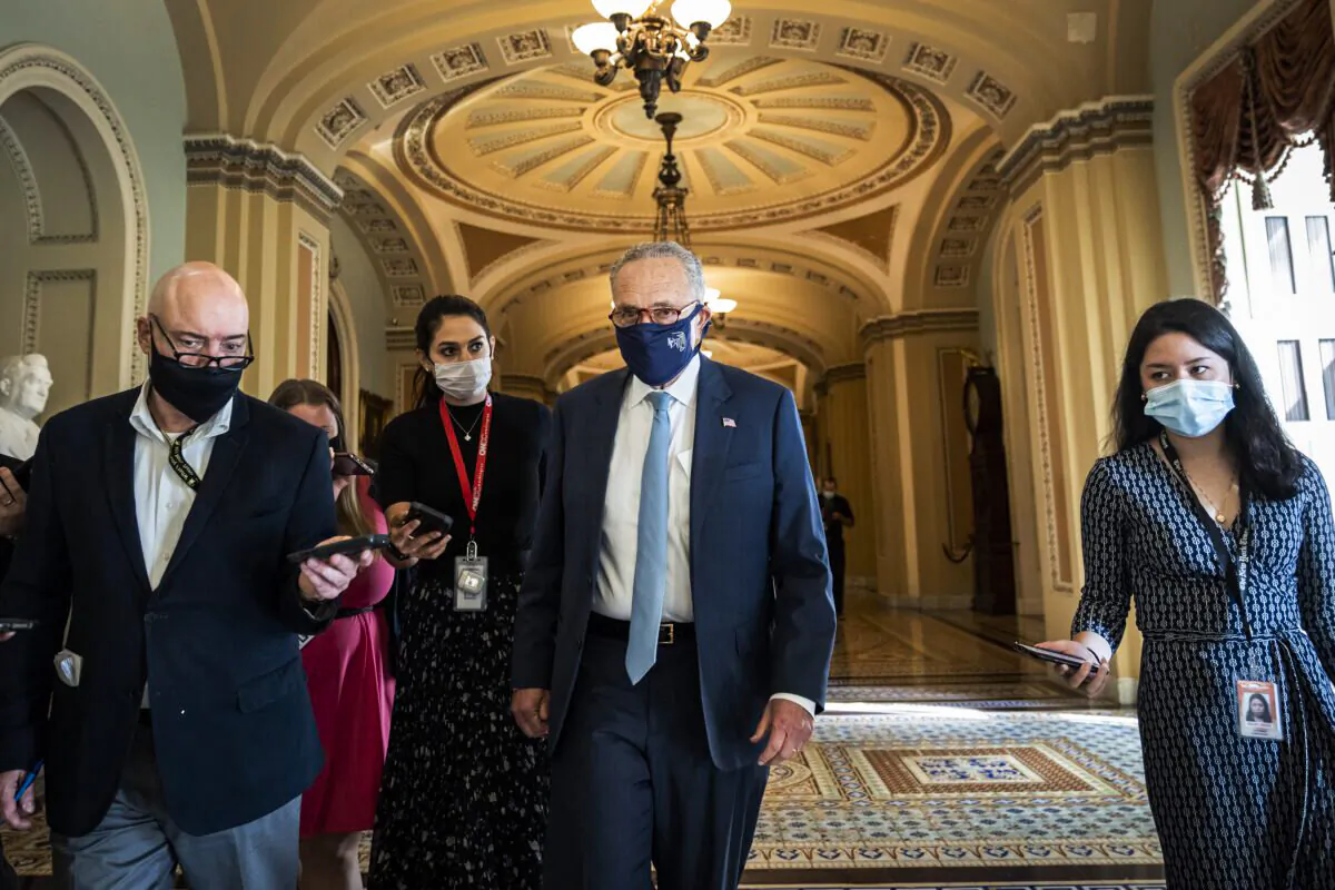 WASHINGTON, DC - OCTOBER 07: Senate Majority Leader Chuck Schumer (D-NY) leaves a lunch meeting with Senate Democrats at the U.S. Capitol October 7, 2021 in Washington, DC. Senate Democrats and Republicans are nearing a deal that will temporarily raise the debt ceiling through early December. (Photo by Drew Angerer/Getty Images)