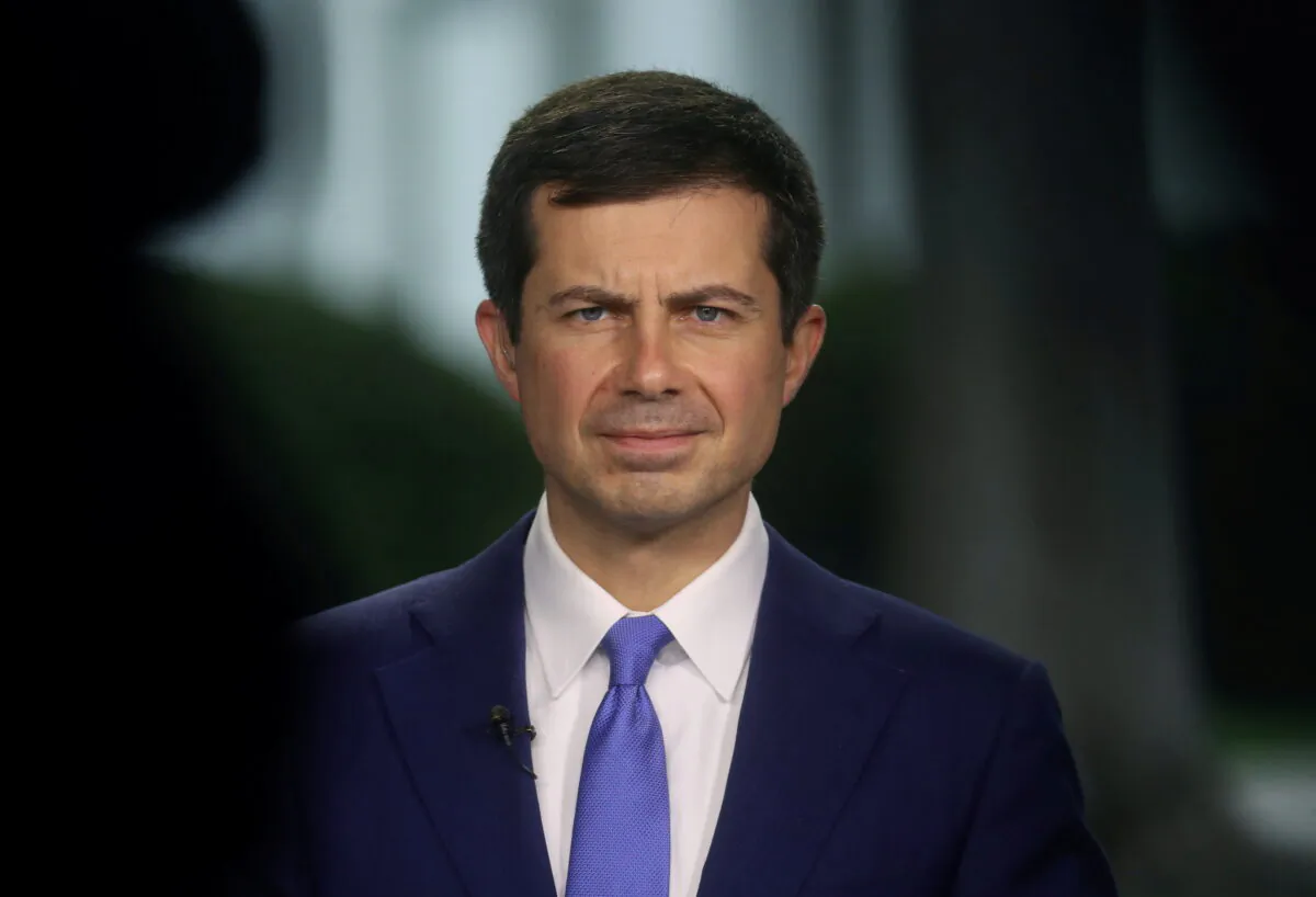 U.S. Secretary of Transportation Pete Buttigieg gives a live interview to the news media outside of the White House in Washington, on Oct. 13, 2021. (Leah Millis/Reuters)