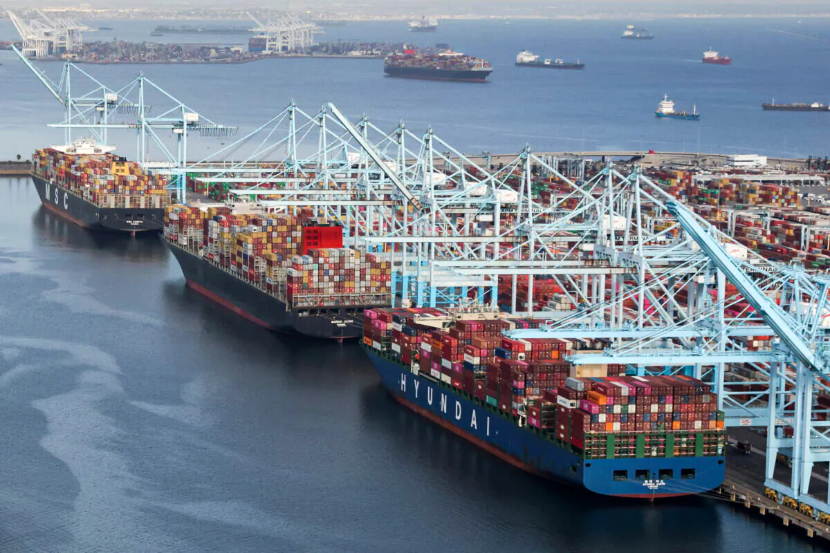Shipping containers are unloaded from ships at a container terminal at the Port of Long Beach-Port of Los Angeles complex in Los Angeles, California, on April 7, 2021. (Lucy Nicholson/Reuters)