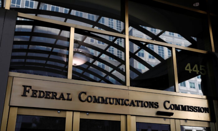 Signage is seen at the headquarters of the Federal Communications Commission in Washington on Aug. 29, 2020. (Andrew Kelly/Reuters)