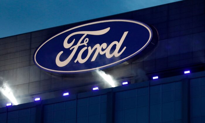 Ford Motor Company's logo is seen on the side of the building at the unveiling of their new electric F-150 Lightning outside of their headquarters in Dearborn, Mich., on May 19, 2021. (Jeff Kowalsky/AFP via Getty Images)