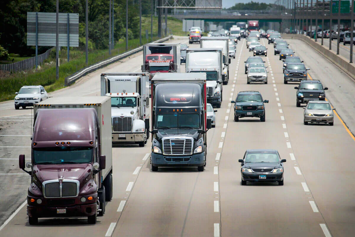 LAKE FOREST, ILLINOIS - JUNE 21: Semi trucks travel along I94 on June 21, 2019 near Lake forest, Illinois. The trucking industry in 2019 has experienced a drop in demand from 2018 and freight rates have fallen year over year for six months straight. (Photo by Scott Olson/Getty Images)