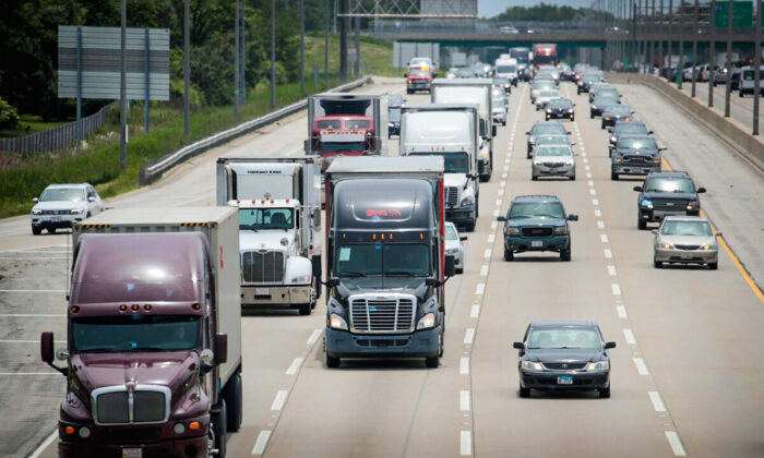 LAKE FOREST, ILLINOIS - JUNE 21: Semi trucks travel along I94 on June 21, 2019 near Lake forest, Illinois. The trucking industry in 2019 has experienced a drop in demand from 2018 and freight rates have fallen year over year for six months straight.  (Photo by Scott Olson/Getty Images)