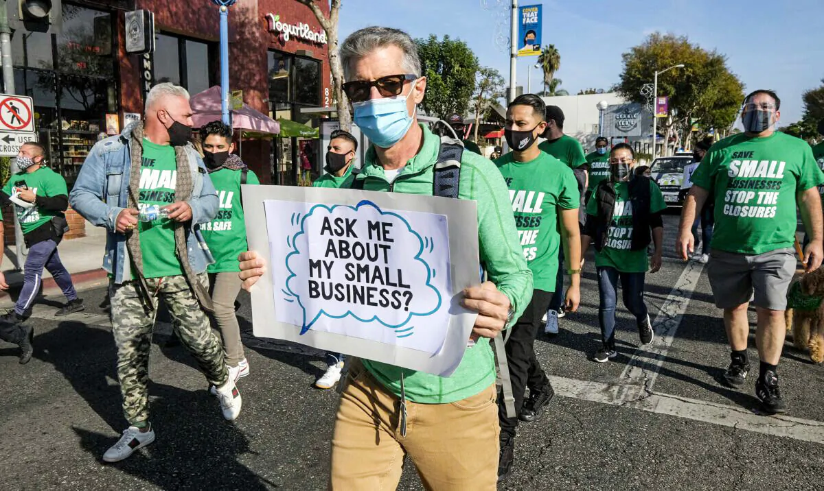 Small-business owners take part in a “Save Small Business” protest in Los Angeles on Dec. 12, 2020. (Ringo Chiu/AFP via Getty Images)