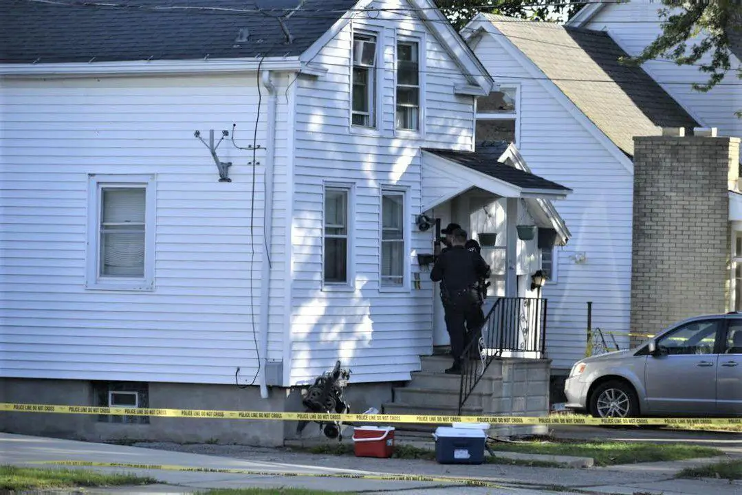 Kenosha Police Officers collect evidence on Oct. 20, 2021, at the scene of a triple homicide that happened late Tuesday night in Kenosha, Wis. (Pete Wicklund/The Kenosha News via AP)