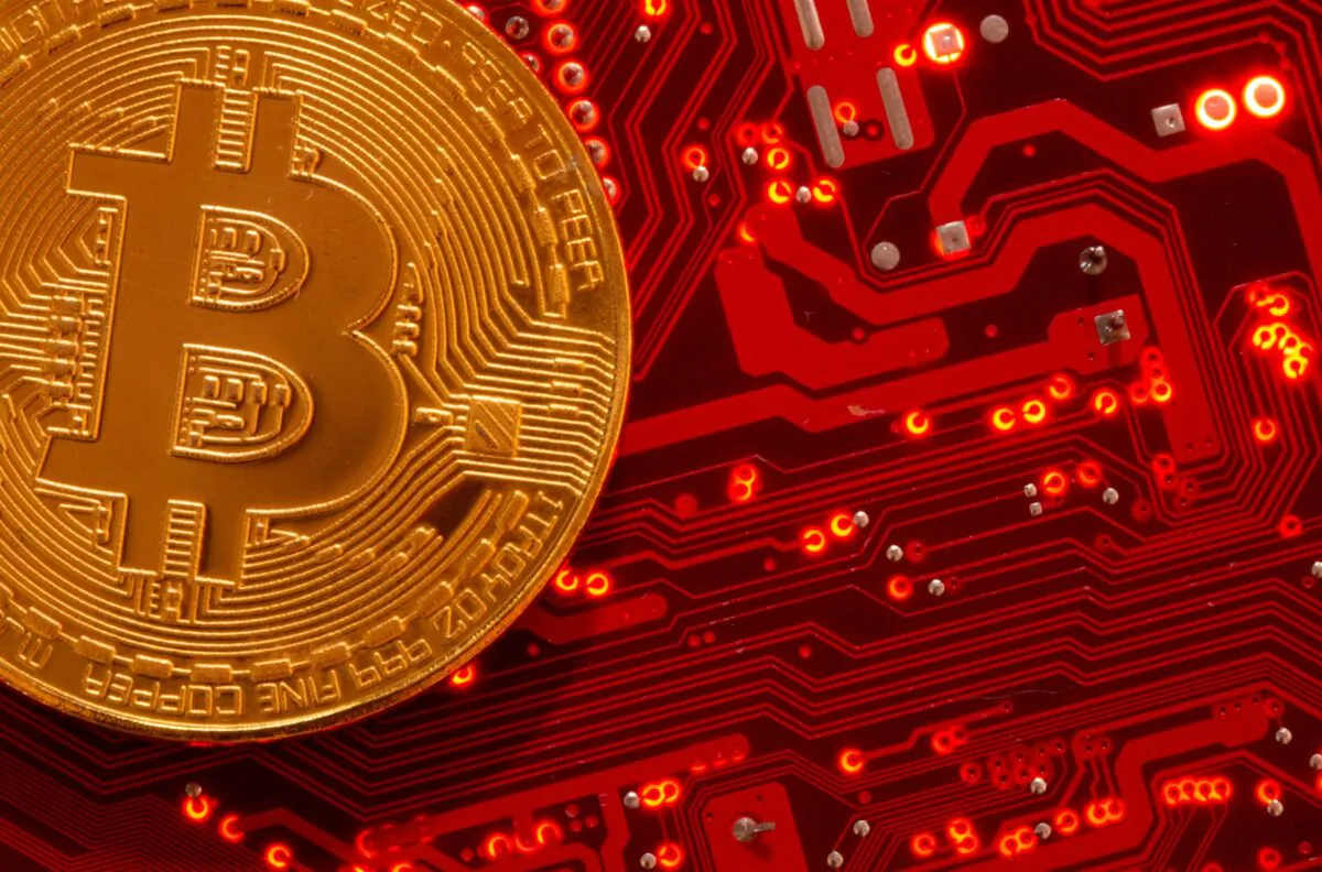 A representation of the cryptocurrency Bitcoin is placed on a computer motherboard in this illustration taken on June 29, 2021. (Dado Ruvic/Reuters)