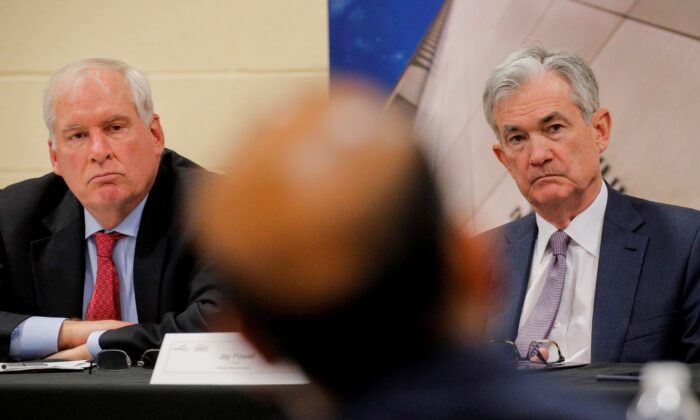Federal Reserve Chair Jerome Powell and then-Boston Fed President Eric Rosengren attend a presentation by the East Hartford CONNects, a Working Cities Challenge initiative, and community residents project at Silver Lane Elementary School in East Hartford, Conn., on Nov. 25, 2019. (Brendan McDermid/Reuters)
