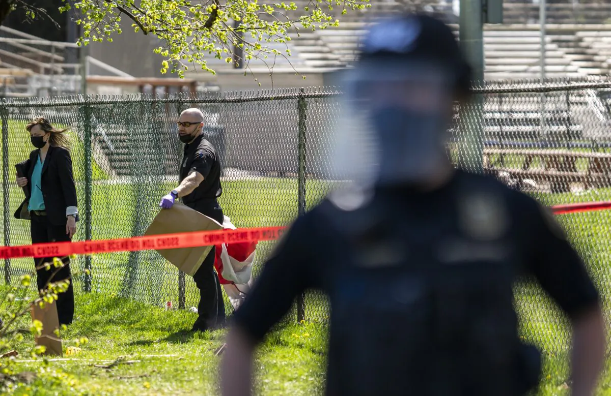 Investigators collect evidence at a crime scene in Portland, Ore., in a file photograph. (Nathan Howard/Getty Images)