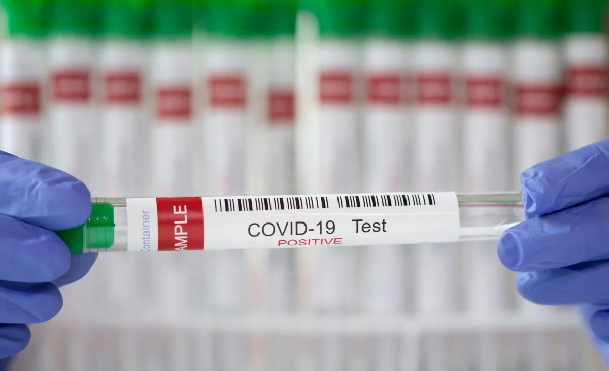 A test tube labelled "COVID-19 Test positive" is seen in this illustration picture taken on March 10, 2021. (Dado Ruvic/Illustration/Reuters)