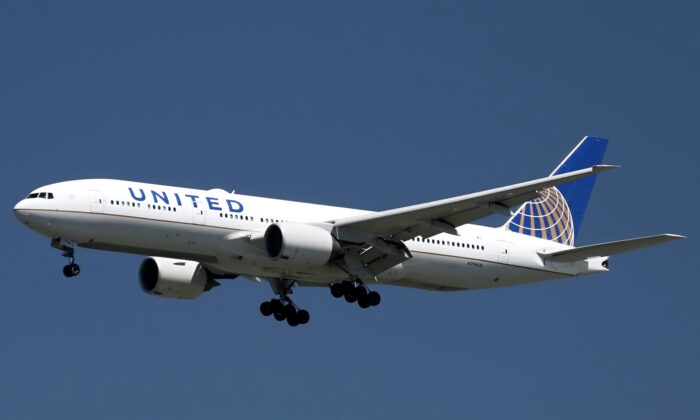 A United Airlines Boeing 777-200ER lands astatine  San Francisco International Airport, San Francisco, Calif., connected  April 14, 2015. (Louis Nastro/Reuters)