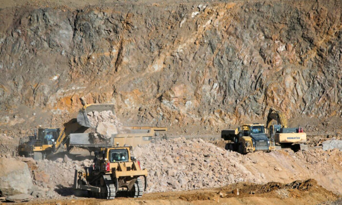 Wheel loaders capable    trucks with ore astatine  the MP Materials uncommon  world  excavation  successful  Mountain Pass, Calif., connected  Jan. 30, 2020. (Steve Marcus/Reuters)